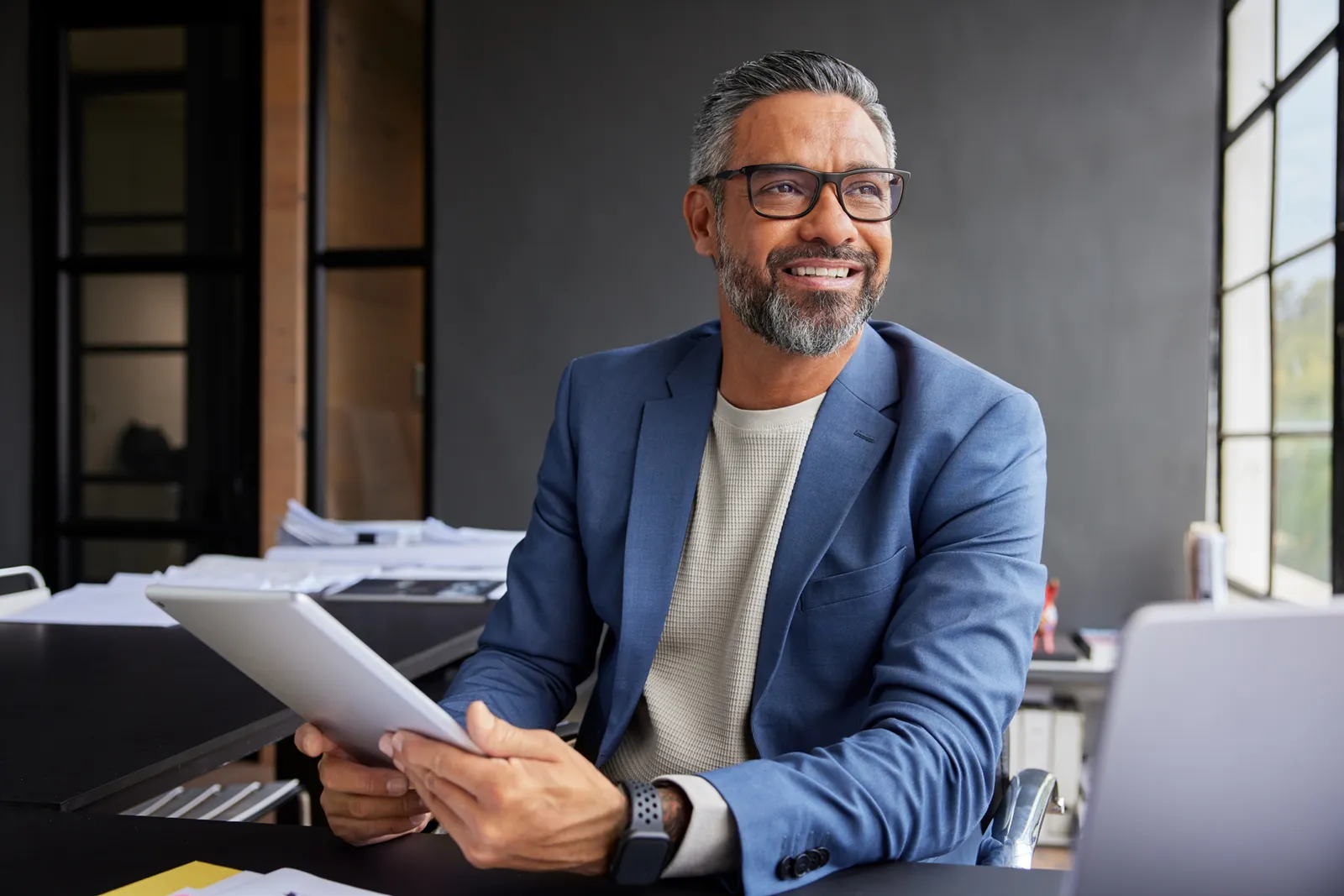 Professional at a desk reviewing planning questions